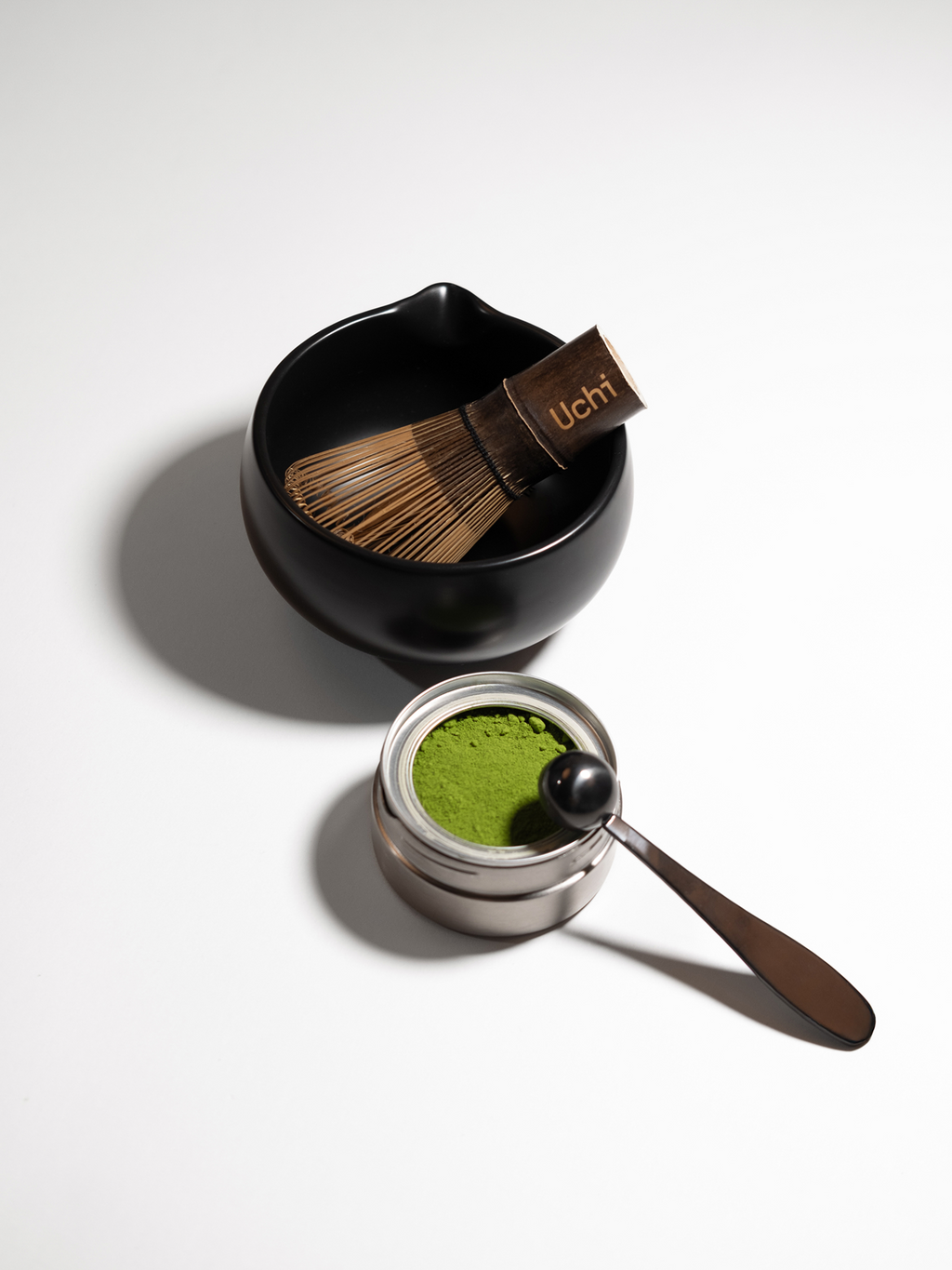 Matcha green tea set with Uchi whisk and bowl on a white background. Matcha canister and refill containing 40g ceremonial grade matcha.