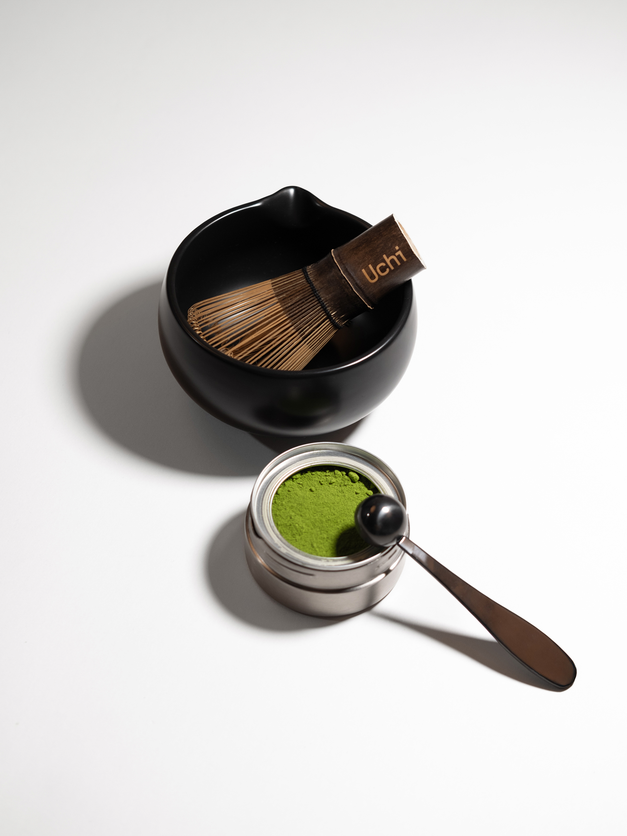 Matcha green tea set with Uchi whisk and bowl on a white background. Matcha canister and refill containing 40g ceremonial grade matcha.