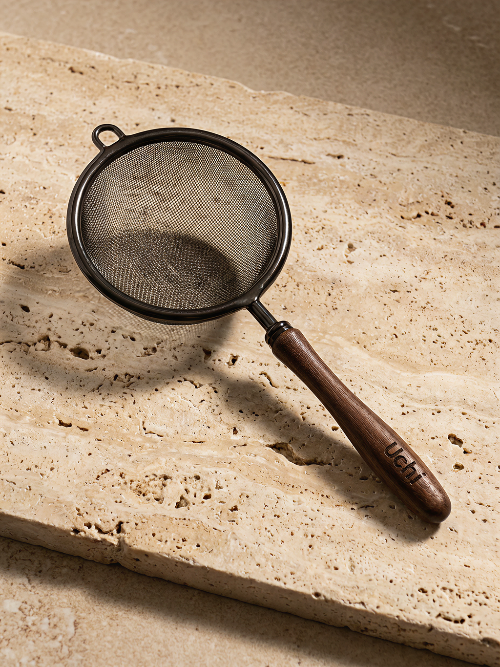 Uchi Sieve, fine mesh matcha sieve with wooden handle on marble surface